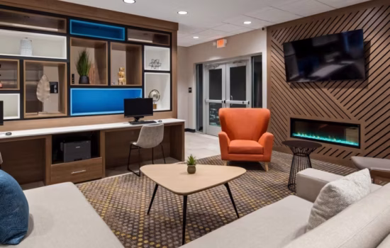 Female business woman pushing suitcase through airport 